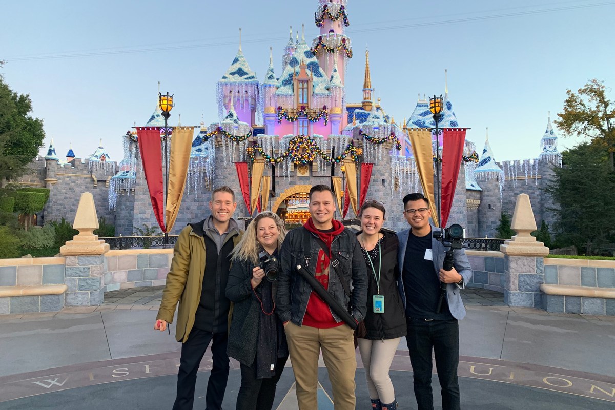 Plug Films team in front of Sleeping Beauty Castle at Disneyland